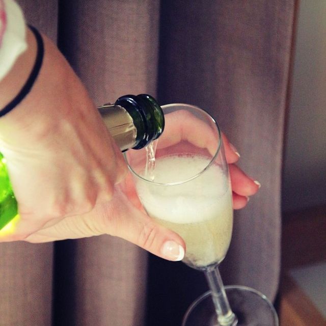 Pouring champagne into glass