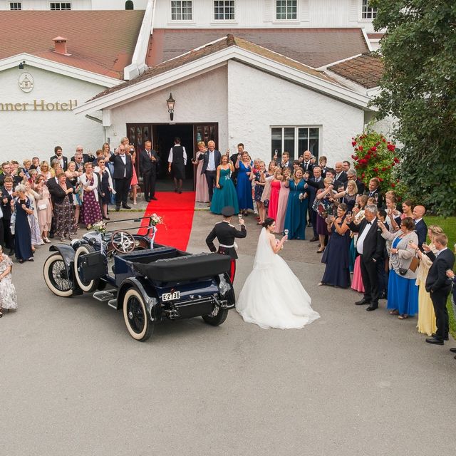 Bride and groom approaching Sanner Hotel