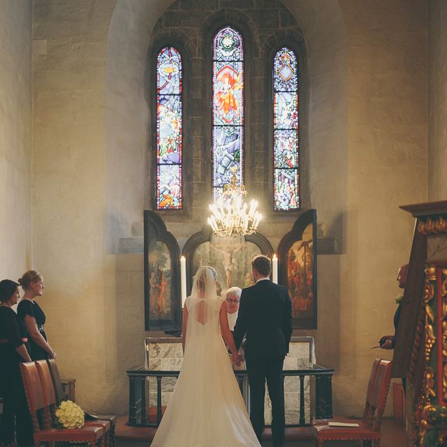 Bride and groom by the alter